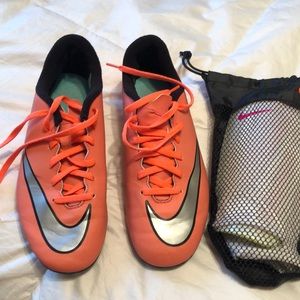 Girls Nike soccer cleats and chin pads